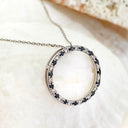Black and white diamond halo pendant