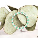 Elegance Defined Emerald And White Diamond in White Gold Halo Pendant