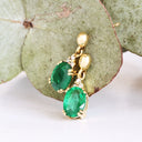 Elegant Oval Cut Emerald and Trilogy Diamond Drop Earrings In Yellow Gold