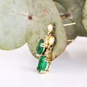 Elegant Oval Cut Emerald and Trilogy Diamond Drop Earrings In Yellow Gold