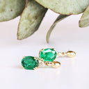 Elegant Oval Cut Emerald and Trilogy Diamond Drop Earrings In Yellow Gold