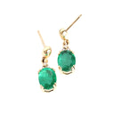 Elegant Oval Cut Emerald and Trilogy Diamond Drop Earrings In Yellow Gold