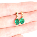 Elegant Oval Cut Emerald and Trilogy Diamond Drop Earrings In Yellow Gold