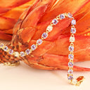 Elegant Round Cut Tanzanite and Diamond Yellow Gold Tennis Bracelet