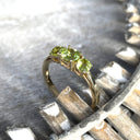 Elegant Trilogy Round Cut Peridot Yellow Gold Ring