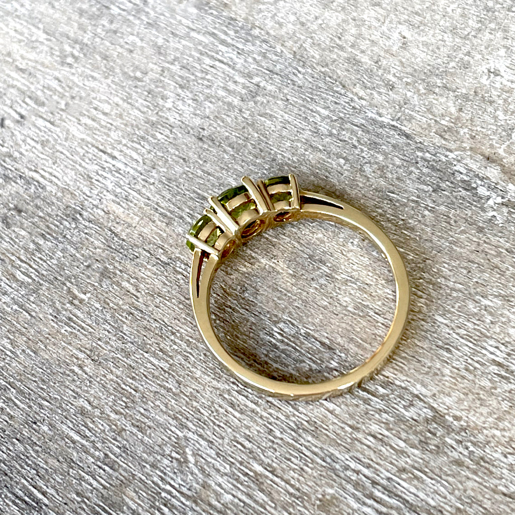 Elegant Trilogy Round Cut Peridot Yellow Gold Ring