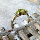 Elegant Trilogy Round Cut Peridot Yellow Gold Ring