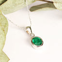 Elegant Tube Set Oval Emerald and Diamond White Gold Pendant