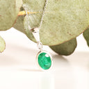 Elegant Tube Set Oval Emerald and Diamond White Gold Pendant