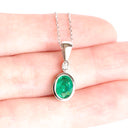 Elegant Tube Set Oval Emerald and Diamond White Gold Pendant