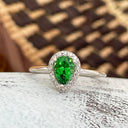 Tsavorite and diamond halo ring