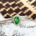 Tsavorite and diamond halo ring