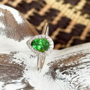 Tsavorite and diamond halo ring