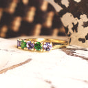 Elegantly Looped Gallery Tanzanite and Tsavorite Yellow Gold Ring