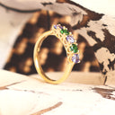 Elegantly Looped Gallery Tanzanite and Tsavorite Yellow Gold Ring