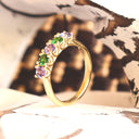 Elegantly Looped Gallery Tanzanite and Tsavorite Yellow Gold Ring