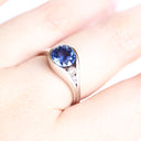 Elegantly Looped Sapphire and Diamond Ring
