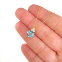 Gorgeous Blue Topaz With Trilogy Diamond Highlight Yellow Gold Pendant And Chain