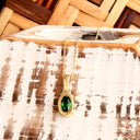 Elegantly Understated Bezel Set Oval Tsavorite Yellow Gold Pendant