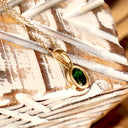 Elegantly Understated Bezel Set Oval Tsavorite Yellow Gold Pendant