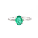 Elevated Four Claw Emerald Ring With Diamond Shoulders In White Gold
