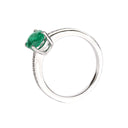 Elevated Four Claw Emerald Ring With Diamond Shoulders In White Gold