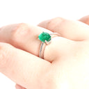 Elevated Four Claw Emerald Ring With Diamond Shoulders In White Gold