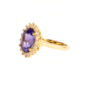Enchanting Oval Shaped Diamond Halo and Tanzanite Yellow Gold Ring