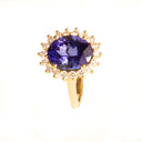 Enchanting Oval Shaped Diamond Halo and Tanzanite Yellow Gold Ring