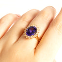 Enchanting Oval Shaped Diamond Halo and Tanzanite Yellow Gold Ring