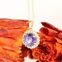 Enchanting Round Cut Tanzanite With Diamond Halo Yellow Gold Pendant