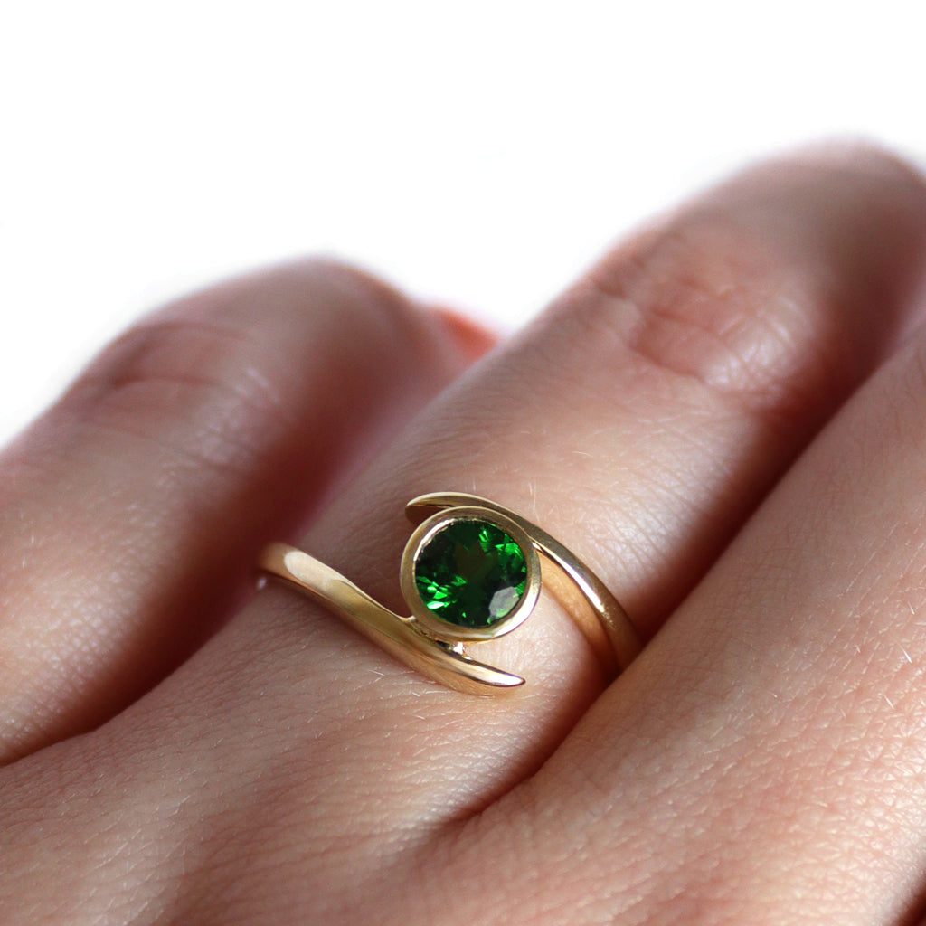 Flirty Twist and Turn Bezel Set Tsavorite Yellow Gold Ring