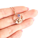 Gold Circular Table Mountain pendant with Tanzanite Highlight in Rose Gold