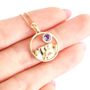 Gold Circular Table Mountain pendant with Tanzanite Highlight in Yellow Gold