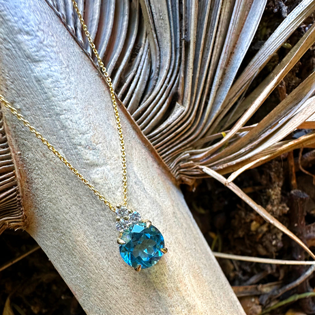 Gorgeous Blue Topaz With Trilogy Diamond Highlight Yellow Gold Pendant And Chain