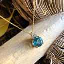 Gorgeous Blue Topaz With Trilogy Diamond Highlight Yellow Gold Pendant And Chain