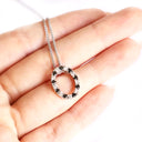 Gorgeous Oval Black and White Diamond Halo Pendant