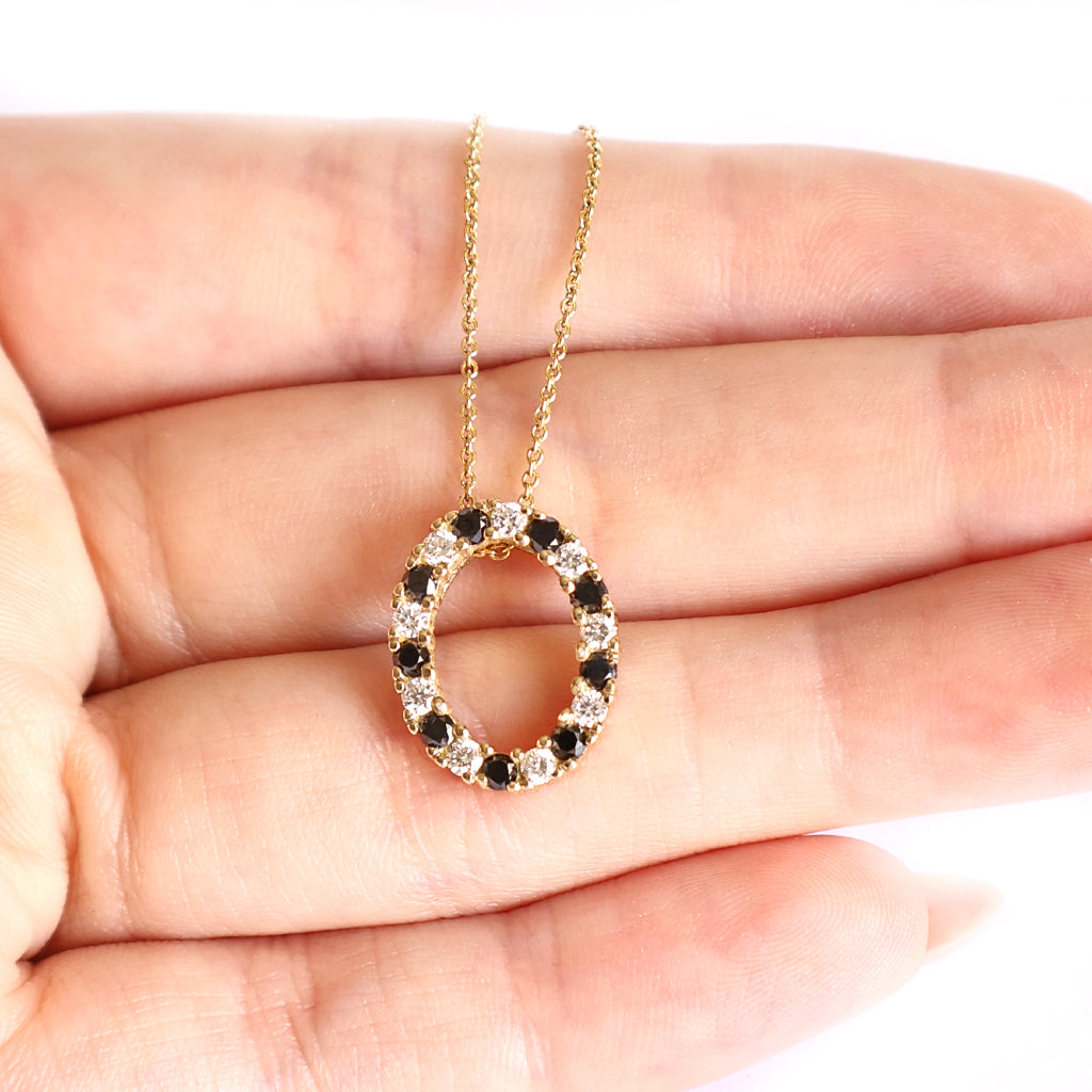 Gorgeous Oval Black and White Diamond Yellow Gold Halo Pendant