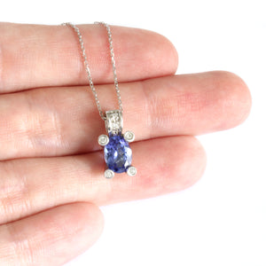 Gorgeous Oval Cut Tanzanite with Diamond Claw, Bale and Band Accent Pendant