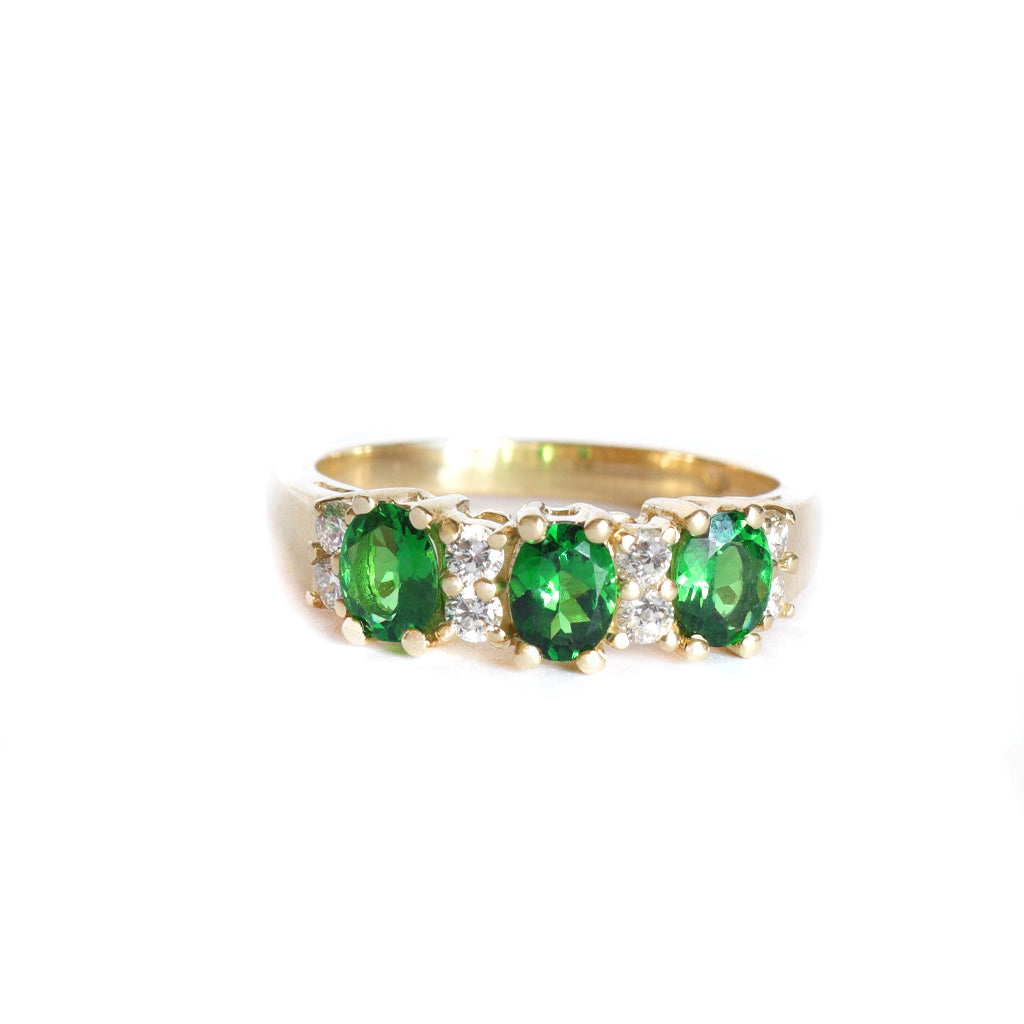 Gorgeous Trilogy Oval Tsavorite and Double Diamond Accent Ring