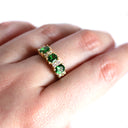Gorgeous Trilogy Oval Tsavorite and Double Diamond Accent Ring