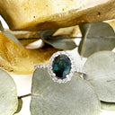 Green Hued Teal Sapphire and Diamond Halo White Gold Ring