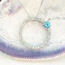 Blue Topaz and Diamond Halo Pendant
