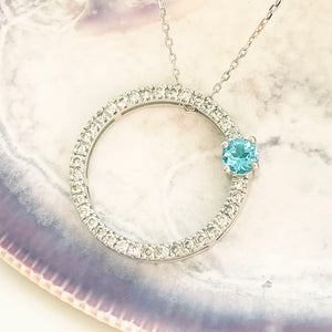 Blue Topaz and Diamond Halo Pendant