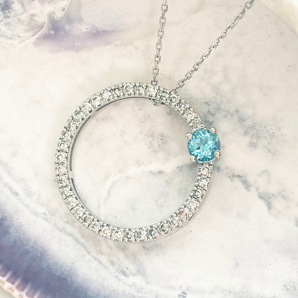 Blue Topaz and Diamond Halo Pendant
