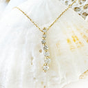 Subtle S Curve Double Claw Petite Diamond Pendant