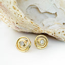 Flirty Infinity White Diamond Yellow Gold Swirl Studs