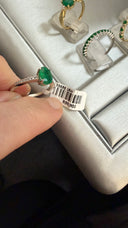 Elevated Four Claw Emerald Ring With Diamond Shoulders In White Gold