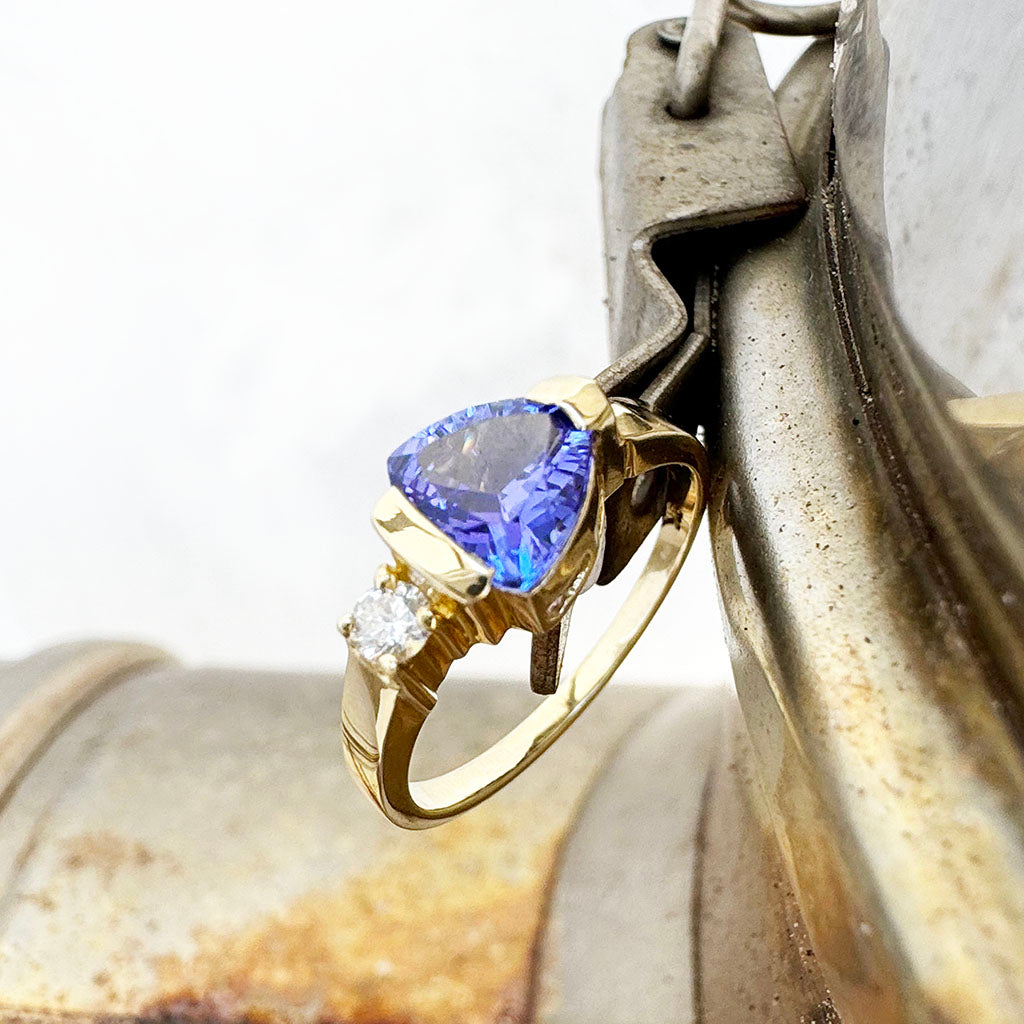 Trilliant Cut Tanzanite with Singular Diamond Accent Yellow Gold Ring