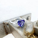 White Gold Double Claw Trilliant Cut Tanzanite With Diamond Shoulder Highlight Ring